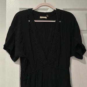 Black jumpsuit small on the road